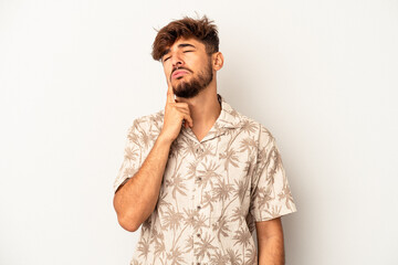 Young mixed race man isolated on grey background crying, unhappy with something, agony and confusion concept.