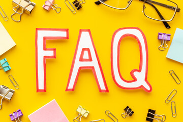 Business concept faq frequently asked questions on office table