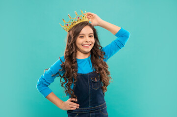 happy child in crown. self confident queen. expressing smug. arrogant princess in tiara.