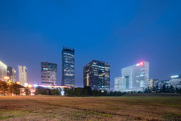 Night view of office buildings in Suzhou Financial District, China