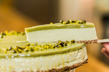 Light but delicious, pistachios  yogurt cheesecake. Close up