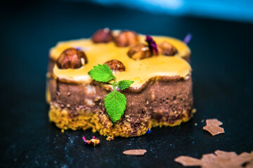 Delicious chocolate sweet dessert with nuts and mint.  Close up
