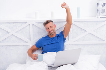 Wake up and smell the coffee. Happy man wake up from sleep. Good morning