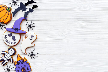 Flat lay pattern of halloween cookies and sweets. Party background