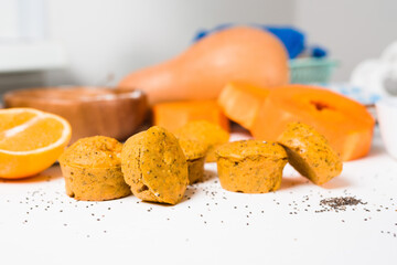 pumpkin cupcakes in a baking dish with chia seeds, autumn orange pie with orange.