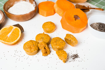 pumpkin cupcakes in a baking dish with chia seeds, autumn orange pie with orange.