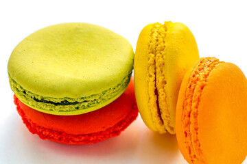 pile of colorful and tasty French Macarons on white background