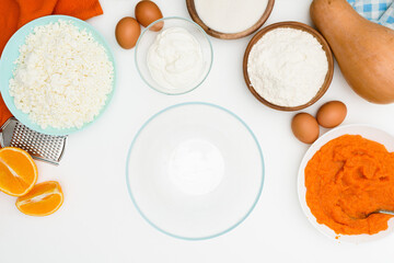 step-by-step recipe for pumpkin curd casserole in the shape of a zebra, orange autumn pie with orange. ingredients for pumpkin pie are visible from the top