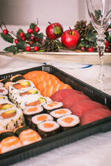 Sushi nigiri and maki set  with Christmas or New Year concept background. Traditional japanese food.
