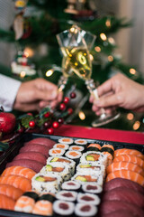 Sushi nigiri and maki set  with Christmas or New Year concept background. Traditional japanese food. © Laia