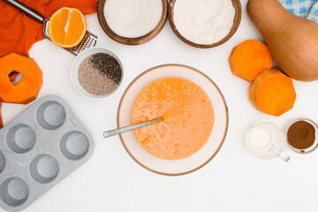 step-by-step recipe for pumpkin cupcakes in the form of chia seeds, autumn orange pie with orange. ingredients for pumpkin pie top view