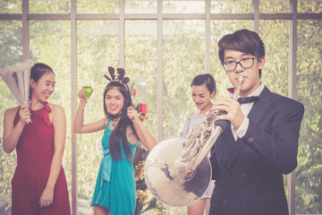 Group of cheerful friend having christmas party and enjoy together at her house.