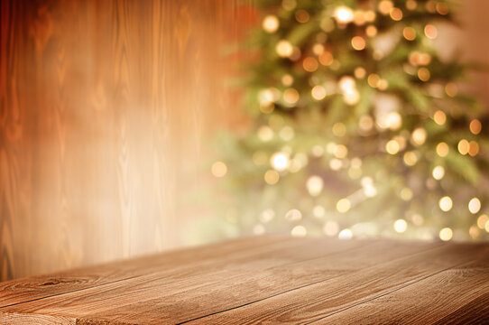 wooden table in the foreground, christmas tree in the background