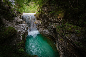Fototapeta na wymiar Small beautiful mountain waterfall
