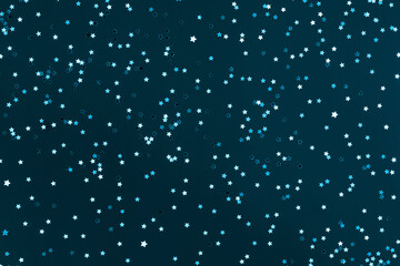 Festive blue green background with many many silver stars. Christmas, New Year or Birthday theme concept. An ideal backdrop for your banner or web design. Backplate for happy holidays presentation
