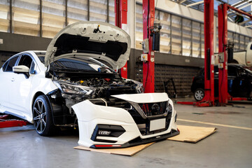 Obraz premium car in automobile repair service center with soft-focus and over light in the background