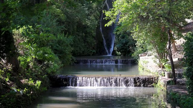 Waterfall in Palace architectural park and botanical garden complex Balchik town, Bulgaria, 4k