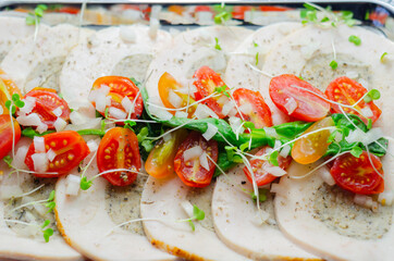 Sliced chicken breast cooked and butter roasted with pork, sage and onion stuffing