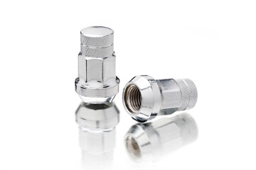 new chrome-plated seven-sided wheel nuts, automotive wheel fasteners isolate on a white background