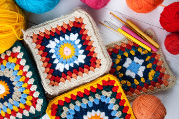 Crochet grandmother's square from colored yarn - obrazy, fototapety, plakaty