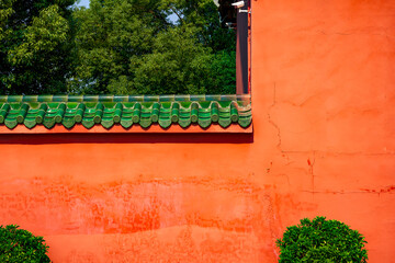 The cinnabar red glaze red wall of the classical building of the Chinese Confucian Temple