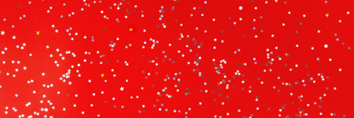 Festive red background with many many silver stars. Christmas, New Year or Birthday theme concept. An ideal backdrop for your banner or web design. Backplate for happy holidays presentation. Banner