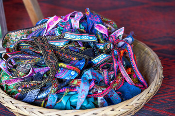 A basket of ethnic costume ribbons and accessories from Guangxi tailor shop