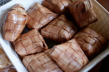 close up photo of a ketupat, it is an authentic Indonesian food.