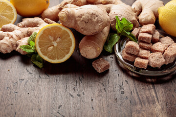 Ingredients for ginger tea on a old wooden table.