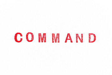 Red color rubber stamp in word command on white paper background