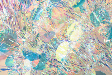 Fototapeta premium Colorful confetti Christmas tinsel garland texture abstract background.