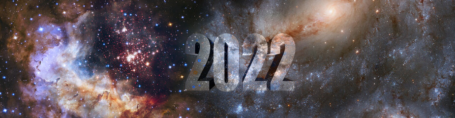 3D image of the new year 2022 on a background with stars and galaxies.