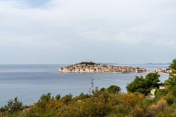 view of the idyllic village of Primosten in Croatia and the coast of the Adriatic Sea