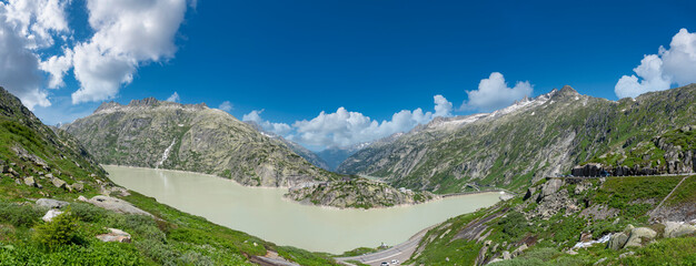 Naklejka na ściany i meble View from the Grimsel Pass road to lake Grimselsee near Guttannen