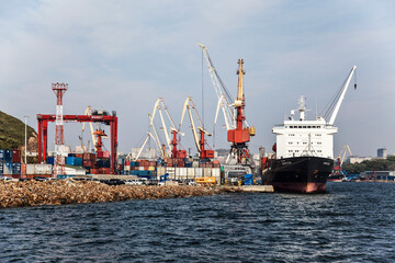 Cargo container ship at the berth of the cargo port in Vladivostok. Far East, Russia
