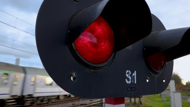 Level crossing red signals on railroad crossing in Rogow, Lodz Province of Poland, 4k footage