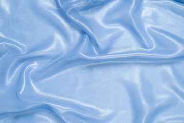 Blue shiny pearl fabric as a background.