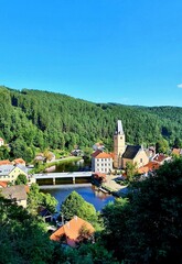 Aerial view of Rozmberk nad Vltavou town and the Vltava river with clear blue sky in South Bohemia, Czech Republic.