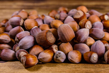 Pile of the hazelnuts on wooden table