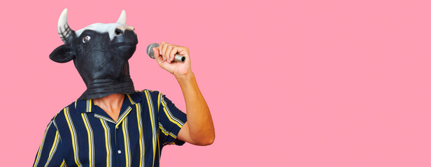 cow man speaking into a microphone, web banner