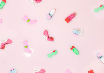 Women's shoes, sandals, high heels, creative composition against pastel pink background. Trendy layout, seasonal sales idea, summer footwear.