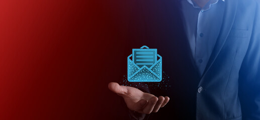 Businessman hand holding letter icon,email icons.Contact us by newsletter email and protect your...