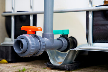 Close up of the colored water tap of an ibc container