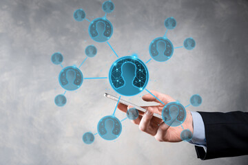 Businessman holding on hand icon of user man,woman low poly polygon style. Internet icons interface foreground. global network media concept.