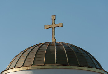 Fototapeta na wymiar Church architecture. Gilded dome of a Christian church with a cross