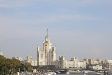 Fototapeta na wymiar Panoramic View of the Stalinist Skyscraper on the Sky Background in Moscow, Russia High-rise Building in the Center of Moscow View of the Moscow River Summer Cityscape from River Tourist Boat
