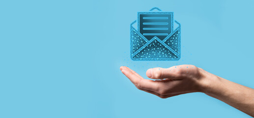 Businessman hand holding letter icon,email icons.Contact us by newsletter email and protect your...