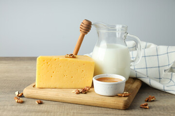 Concept of cooking eating with hard cheese on wooden table