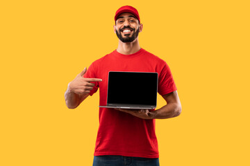 Delivery Guy Showing Laptop Screen Advertising Website Over Yellow Background