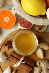 Concept of treatment colds with honey and garlic, close up